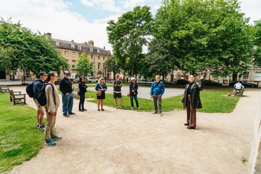 Bath: City Walking Tour with Optional Roman Baths Entry - The Roman Baths stop: geothermal springs, Roman objects, and a reality check on crowds