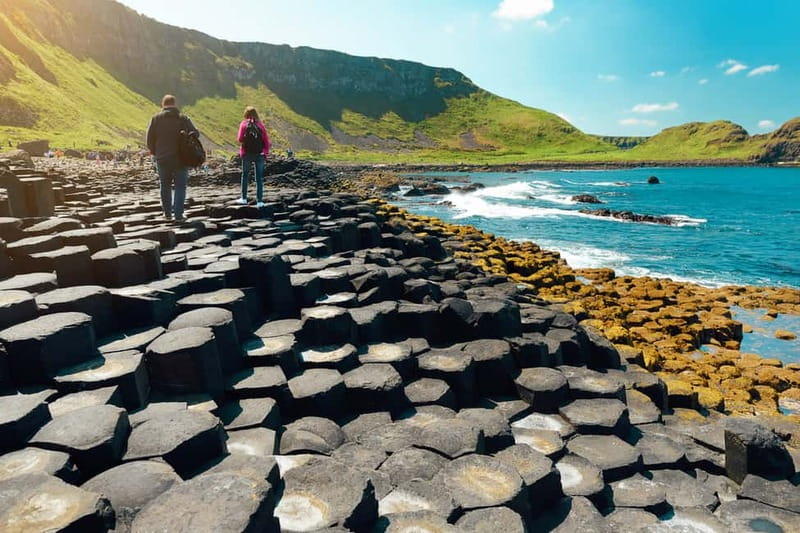 From Belfast: Giant's Causeway Guided Day Tour With Castles - Carrick-a-Rede Rope Bridge viewpoint: stretching your legs by the cliffs