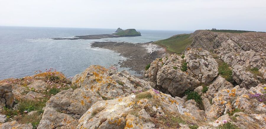 From Cardiff: Mumbles and Gower Peninsular Tour - Worms Head and sea-cliff drama: legends that make the rocks feel alive