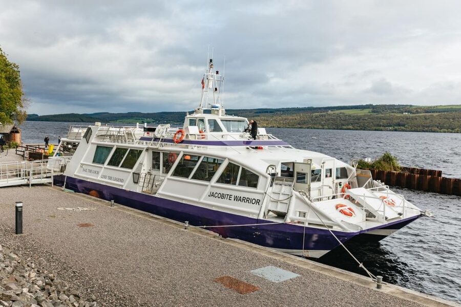 From Inverness: Loch Ness Guided Day Trip - Fort Augustus and Invermoriston: canal boats, summerhouse views