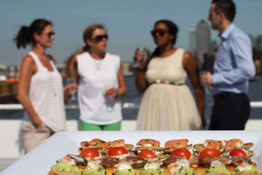 London: River Thames Evening Cruise with Bubbly and Canapés - The onboard vibe: live singer entertainment and chill-out pop