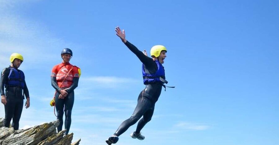 Newquay: Coasteering - The Route Flow: caves, crystal-water gully jumps, and sea tunnels