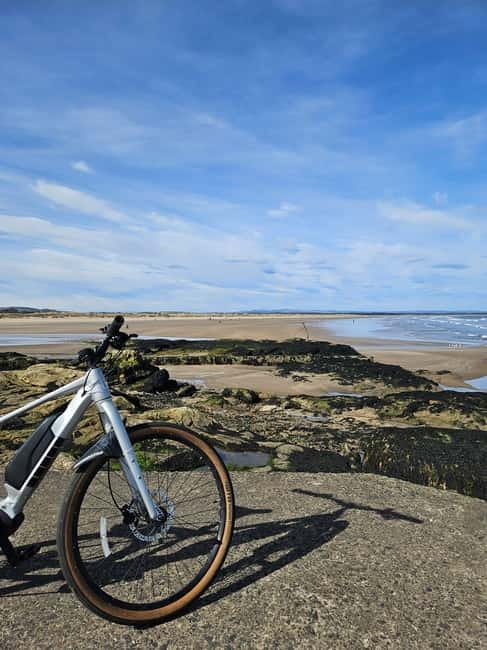 St. Andrews: The Essential Guided Bike & E Bike Tour - Price and bike setup: $66 value, helmet, and E-bike choices